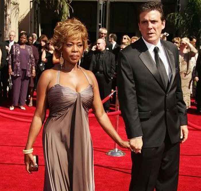 A picture of Roderick Spencer and Alfre Woodard walking down in red carpet.